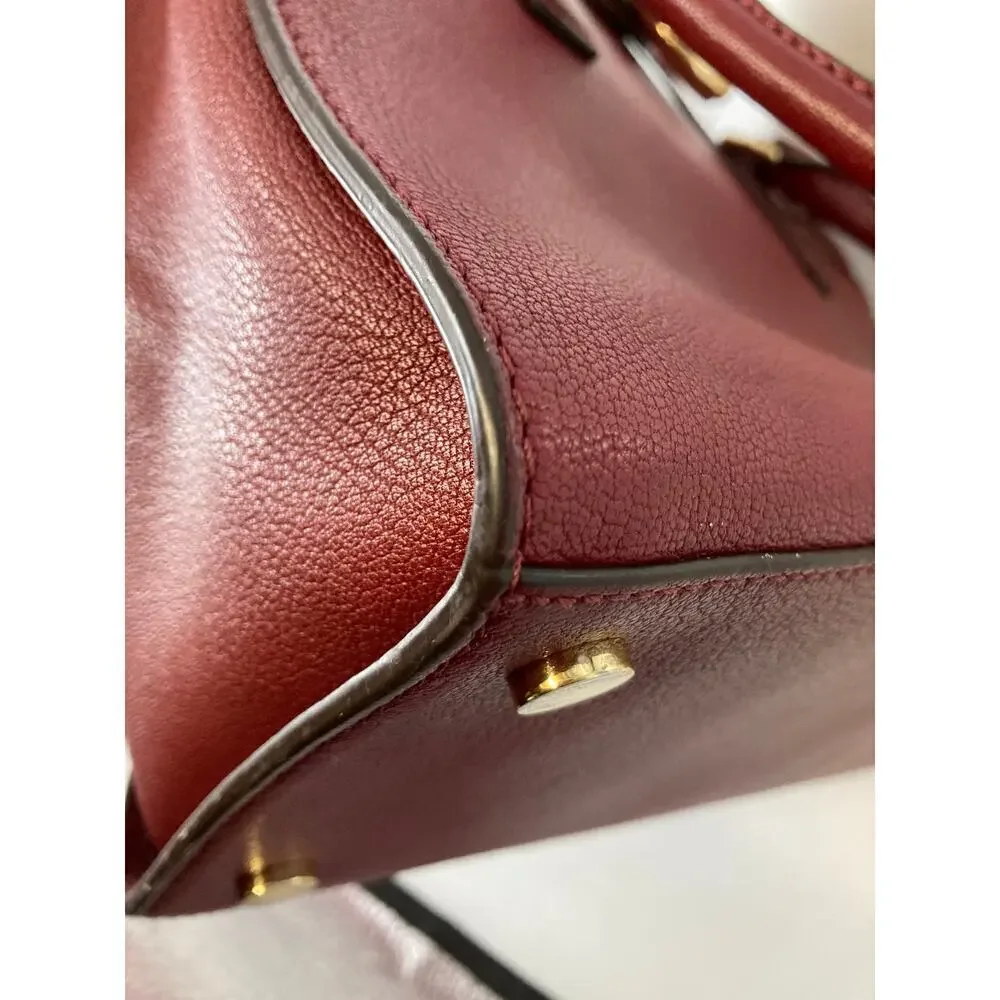 MICHAEL KORS, LARGE WINE LEATHER HANDBAG WITH LOCK CHARM.